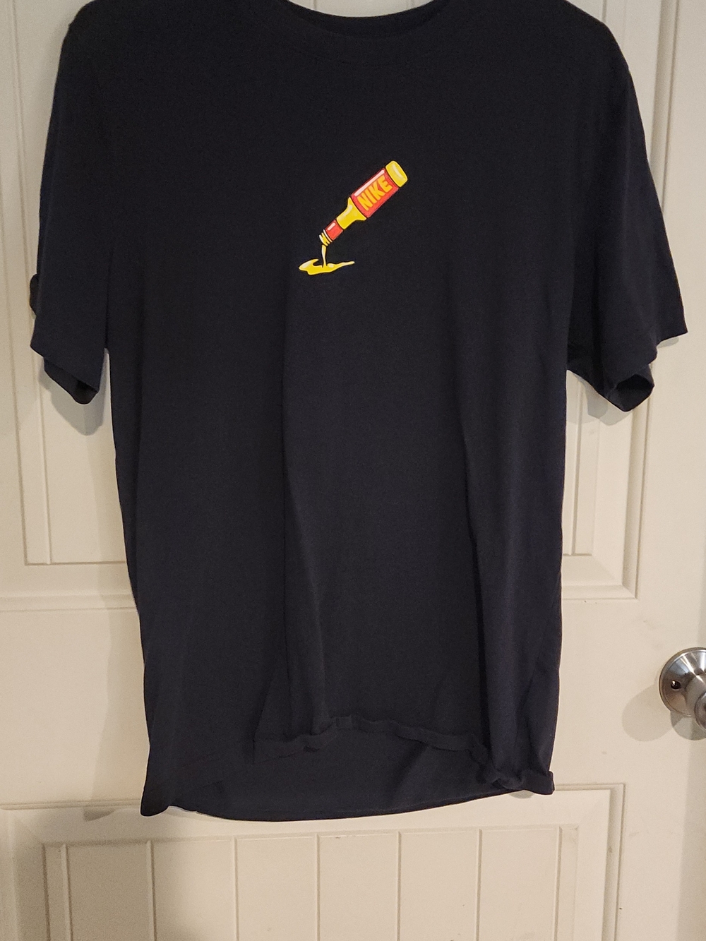 Nike Men's Navy Short-Sleeve Tee with Yellow Pouring Bottle Graphic